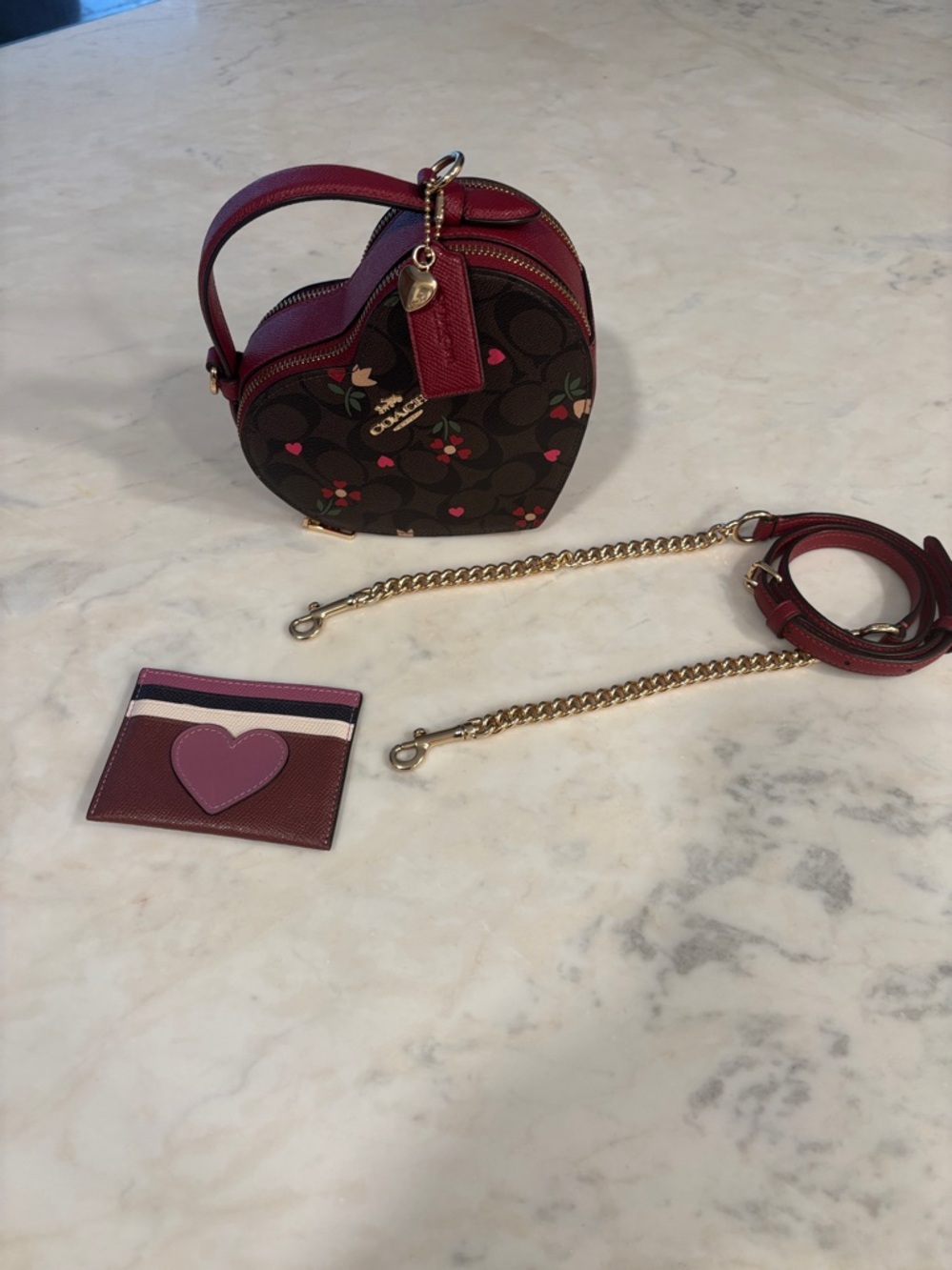 Heart Crossbody
In Signature Canvas Heart Petal Print with Coach heart wallet